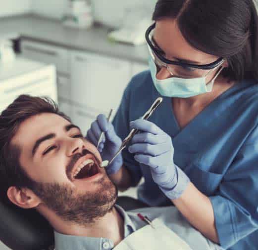 Glendale dentist performing endodontic retreatment on a patient