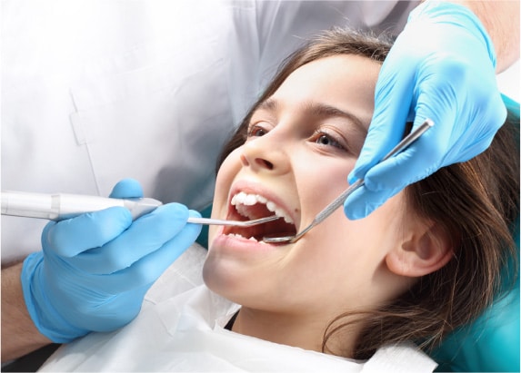 Young patient receiving a dental check-up for pulpotomy treatment in Glendale